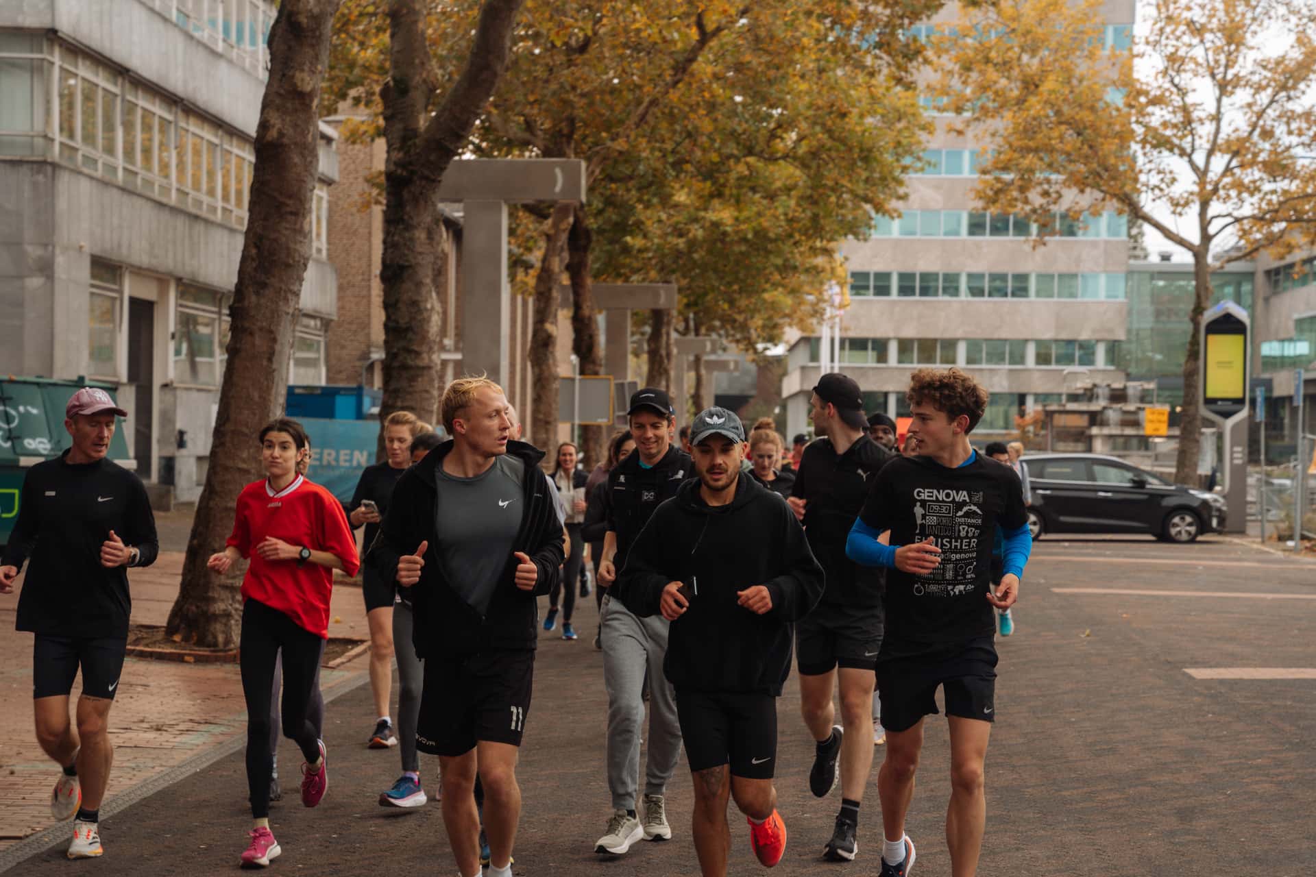 Social Run Club Eindhoven group running through the city at night